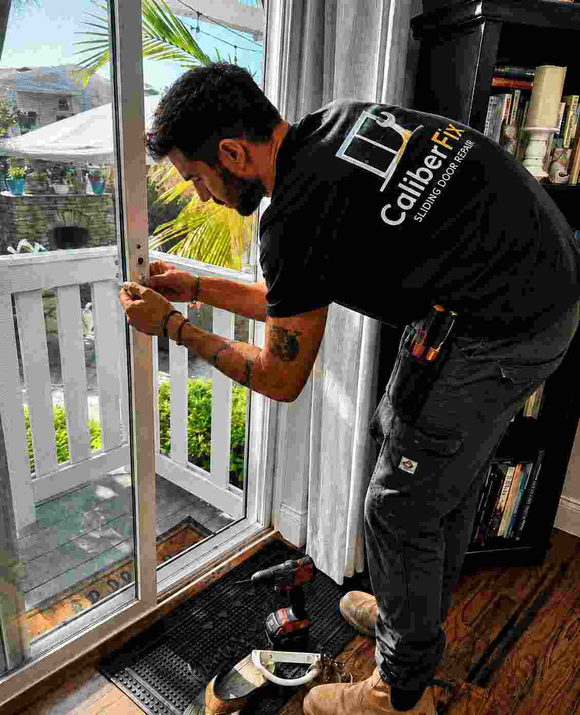 CaliberFix technician repairing a sliding door in a Jacksonville home — Jacksonville, FL