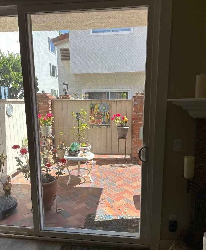 Repaired sliding glass door leading to a courtyard patio — Jacksonville, FL