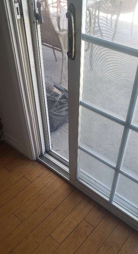 Sliding door track repair close-up — Jacksonville, FL